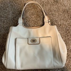 White Kate Spade bag.